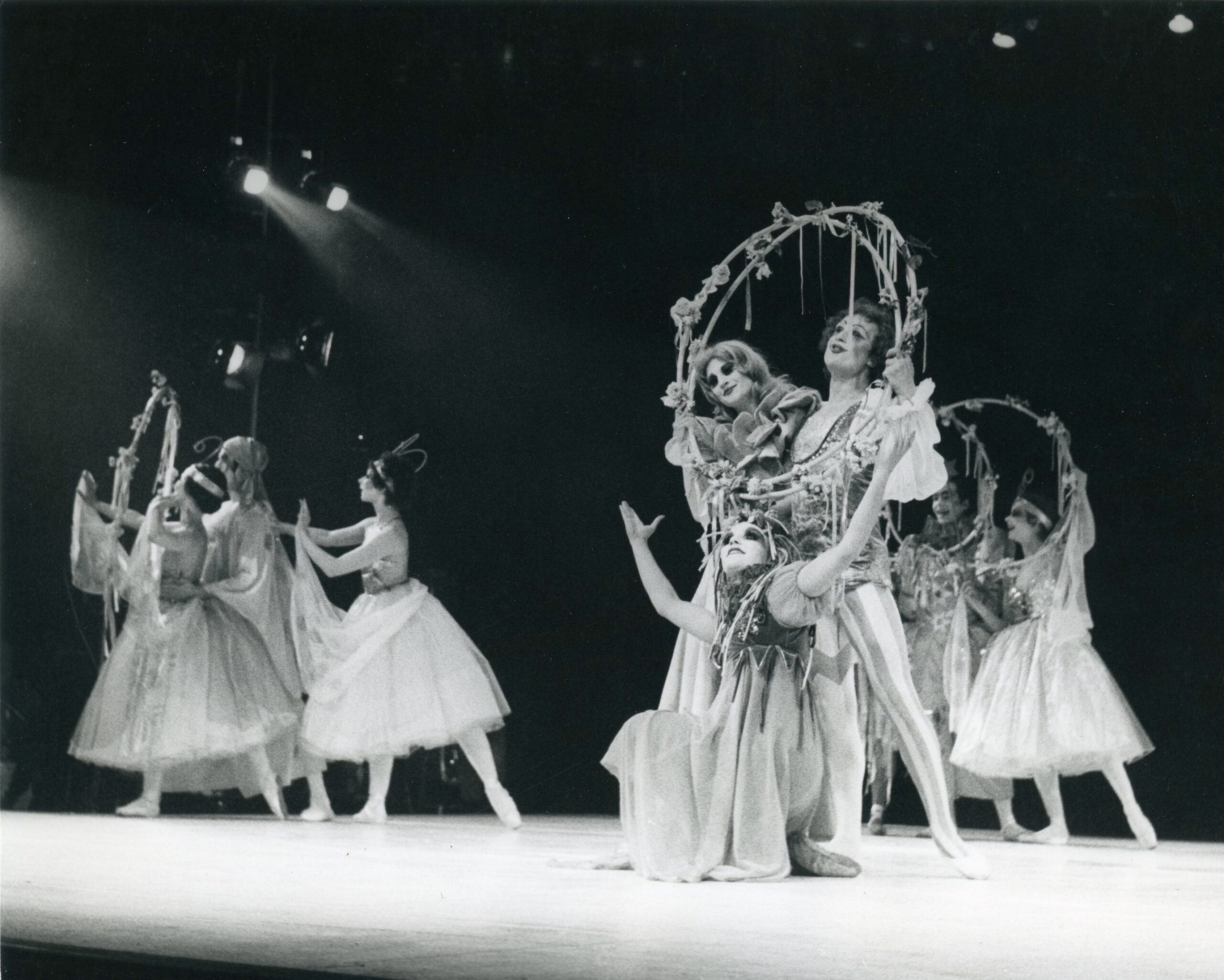 A group of ballet dancers on stage.