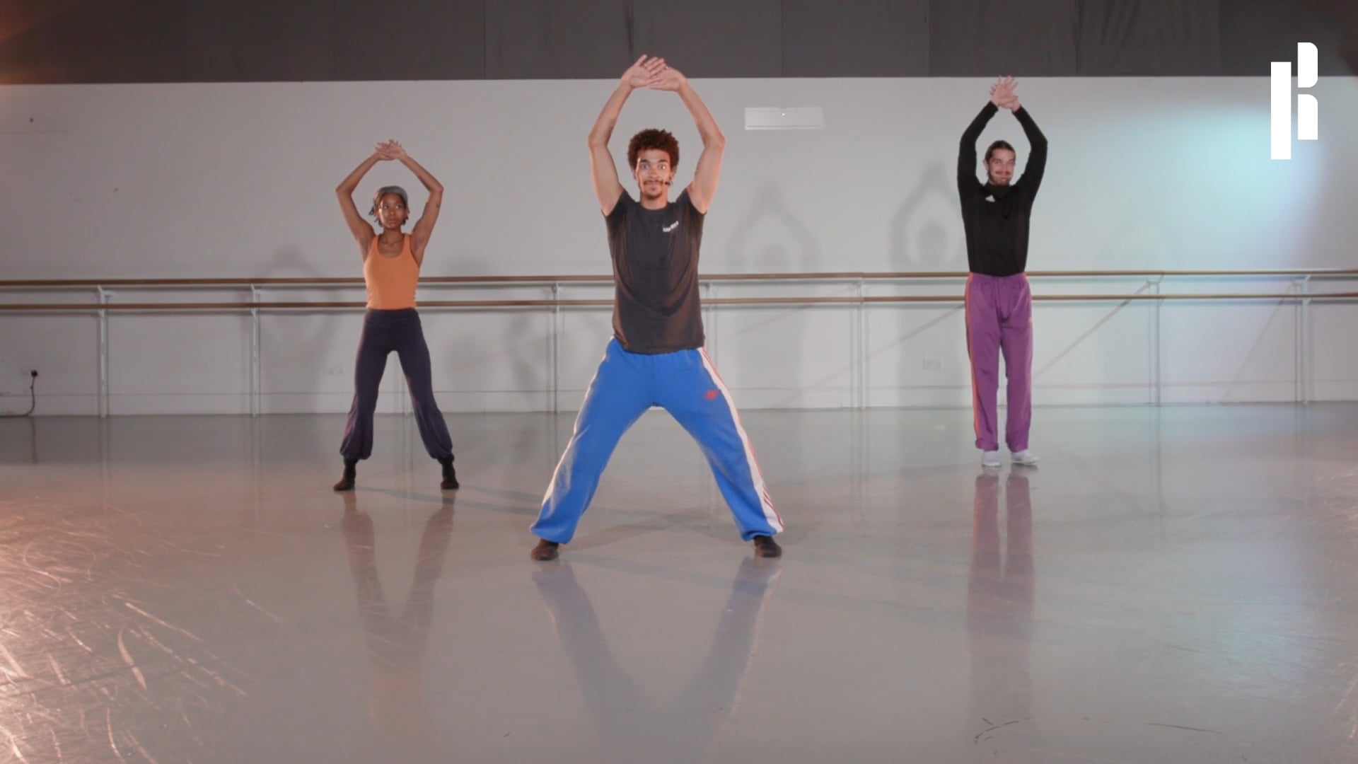 A group of dancers in a dance studio.