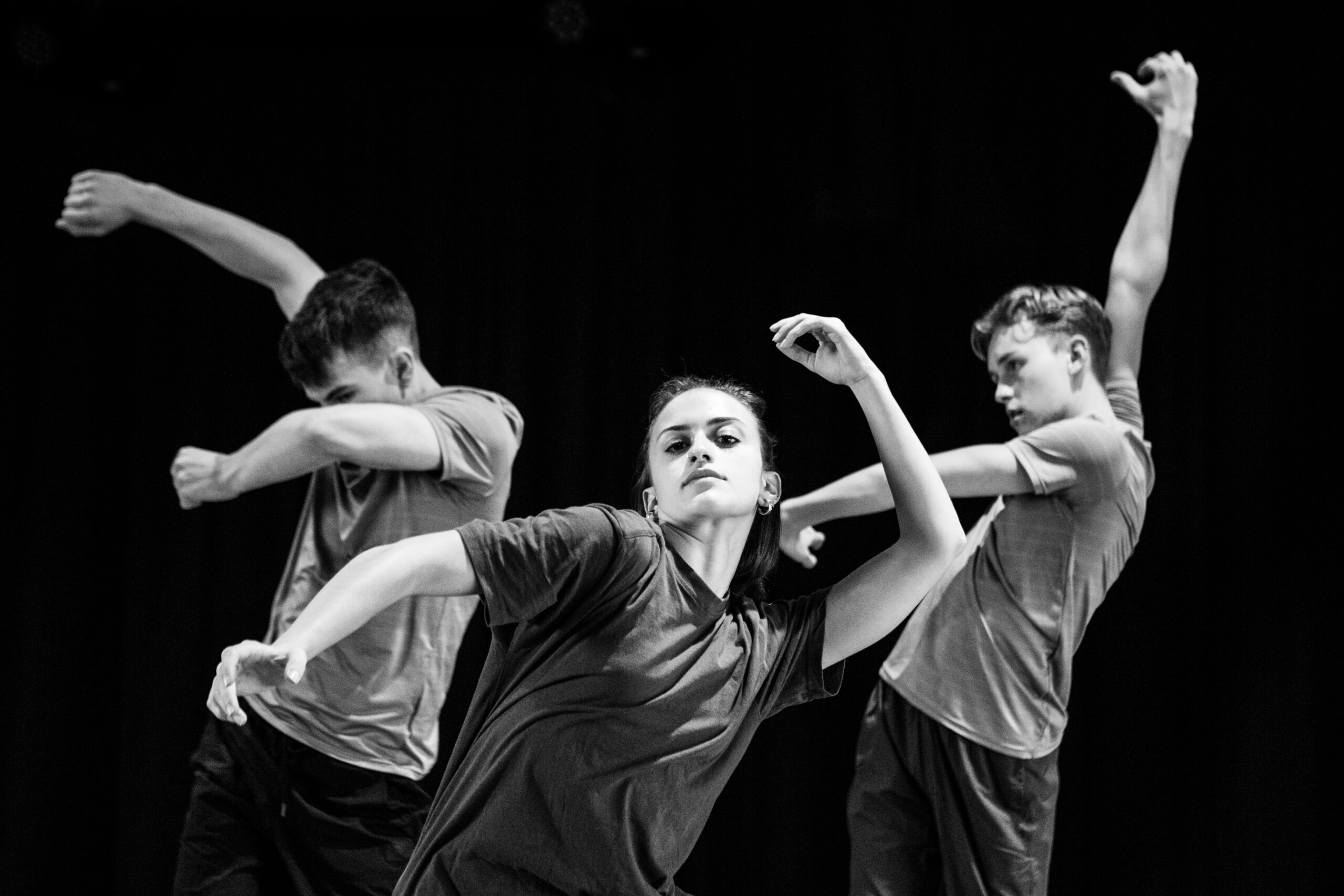 A black and white photo of a group of dancers.
