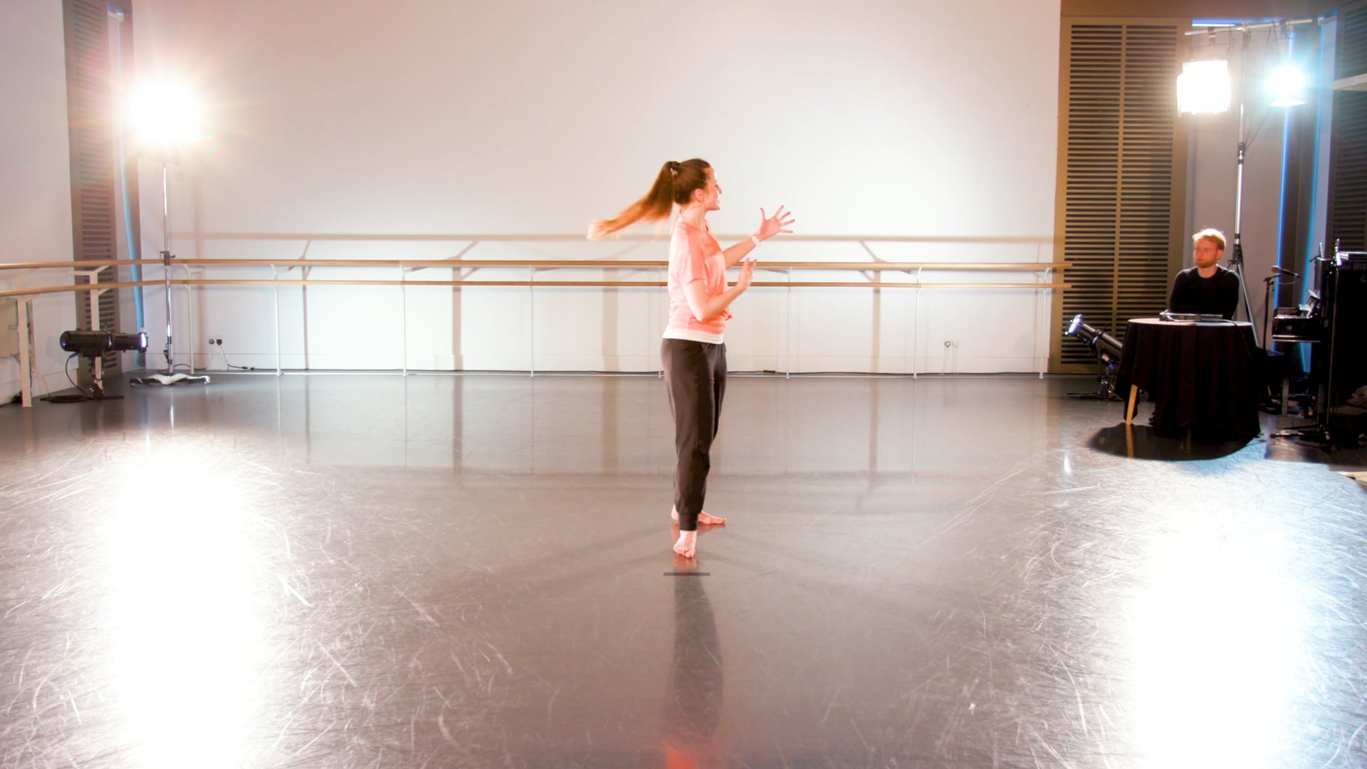 a young girl is dancing on a stage.