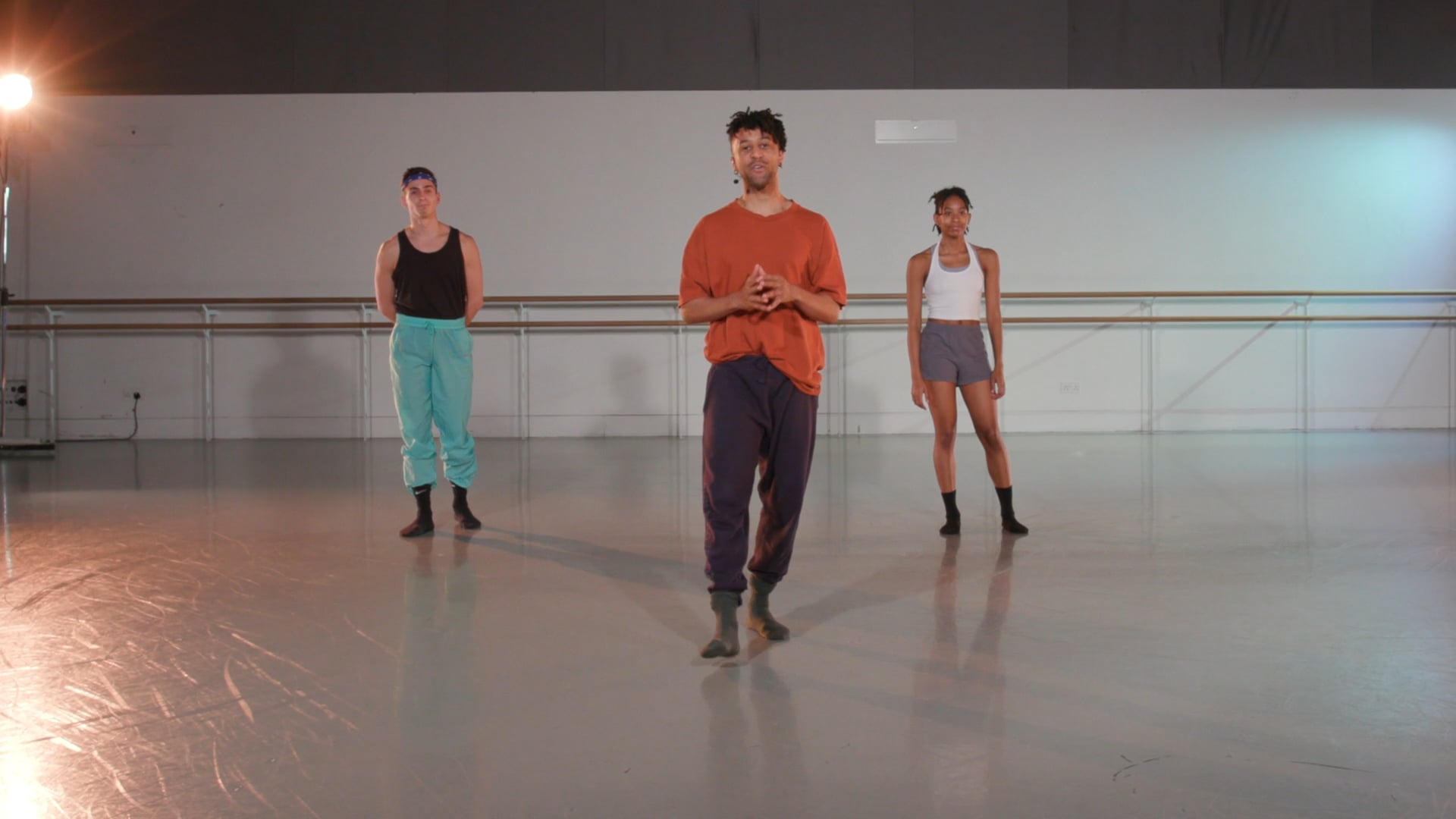 a group of people standing around in a room.