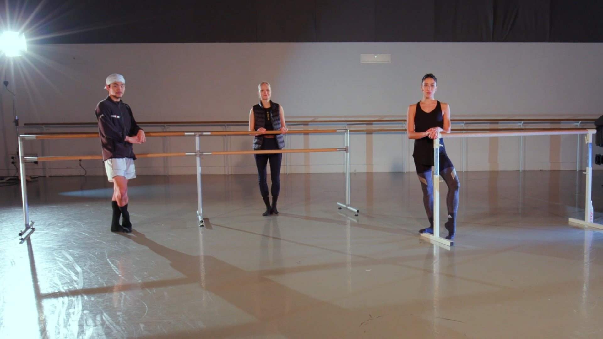 a group of people that are standing in a room.