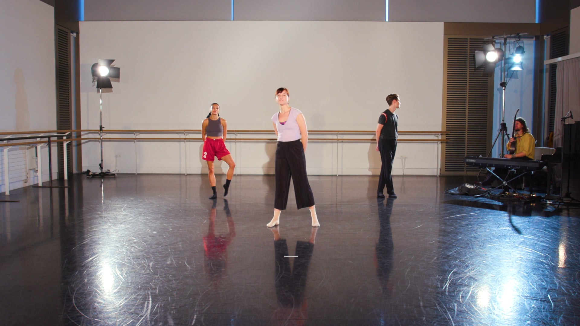 a group of people in a dance studio.