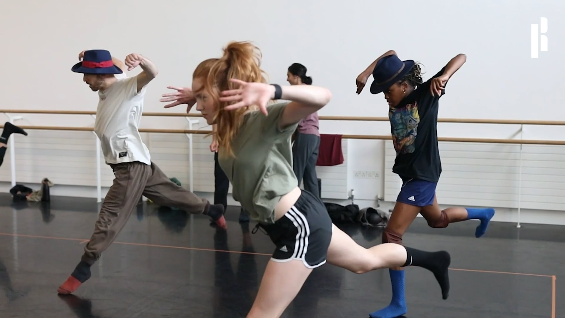 a group of young people dancing in a dance studio.