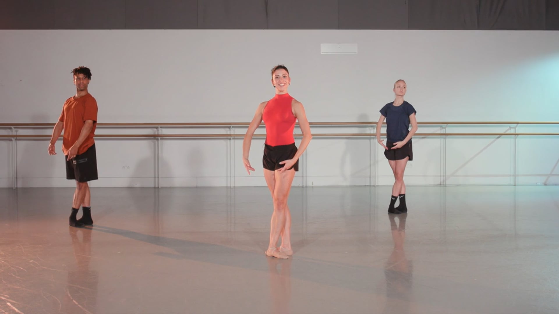 a group of dancers in a dance studio.