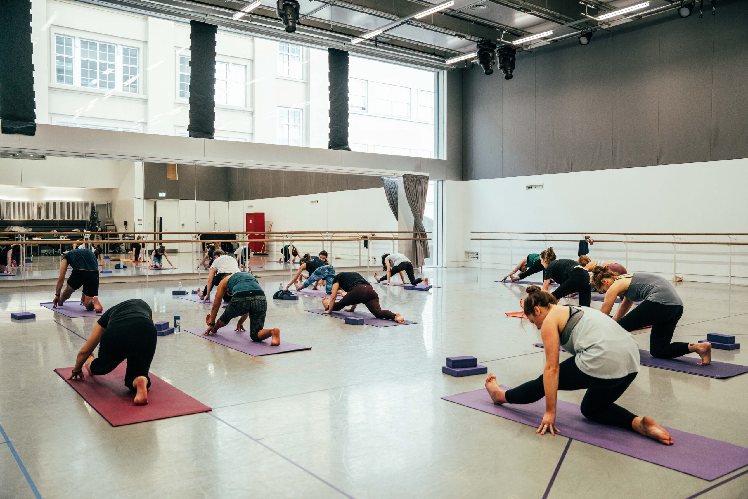 Group of pilates students inside a studio