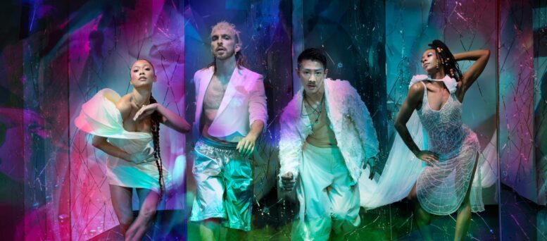 This is Rambert lead image with four dancers dressed in white looking at the camera and overlay colourful projections